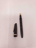 Cap and barrel of Waterman's Shorthand fountain pen separated