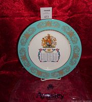 Front view of Aynsley commemorative plate on stand