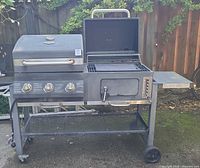 Full view of Expert Grill DH122212W combo grill showing propane side, smoker side, control knobs, side shelf and wheels