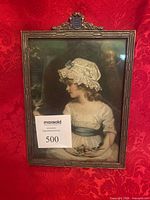 Full view framed print against red background