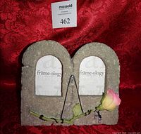 Front view of stone Frameology double picture frame with 3D rose, showing arched openings and easel stand