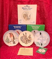 All three plates with their original boxes and paperwork