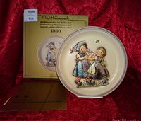 Plate with box and pamphlet displayed