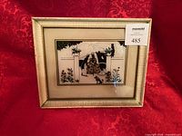 Front view of framed J. Jensen foil art