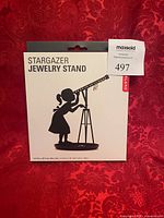Front of Kikkerland Stargazer Jewelry Stand box