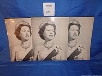 Front view showing three identical writing pads with Queen Elizabeth II portrait
