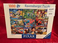 Front of sealed Ravensburger Disney Pixar puzzle box showing artwork and piece count