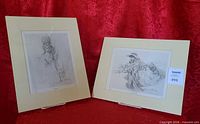 Both matted lithographs side by side