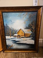 Full view of framed winter landscape painting