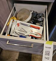 Drawer view showing entire assortment of kitchen tools