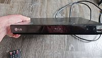Front view LG BP200 player with remote in frame
