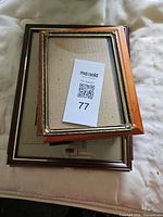 Stacked small frames showing wood and metal examples