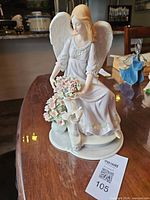 Full front view of porcelain angel figurine on table