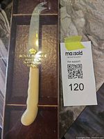 Full knife in presentation box with lot tag visible