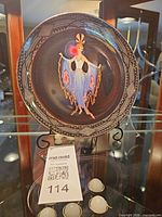 Front view of Royal Doulton Erté Twilight plate on stand