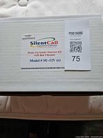 Manufacturer box top with Silent Call Communications branding and model information