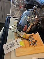 Teapot on trivet atop bamboo and plastic cutting boards