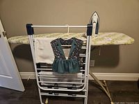 Ironing board, drying rack and iron assembled