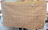 Front view of full quilt held up