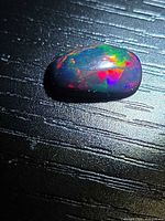 Top view of Ethiopian black opal showing play-of-colour