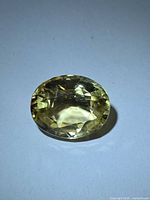 Oval golden scapolite gemstone top view