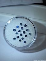 All sapphires displayed in gem jar, showing quantity, color range and cut