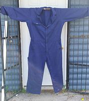 Front view of one navy blue coverall fully displayed