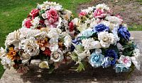 Top view of four artificial flower arrangements on table