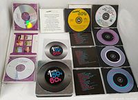 Open jewel cases displaying Reader's Digest and Time Life CDs