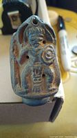 Front view showing molded warrior figure on bowl