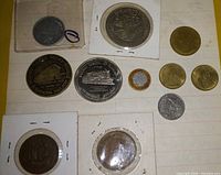 Overview of all coins on lined paper
