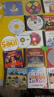 Overall view of first subset of CDs and DVDs showing titles such as Soul Vol.1 and Greatest Feel Good Hits