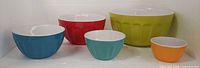 Front view of all five colourful nesting bowls