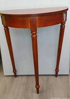 Front view of half-circle wood hall table