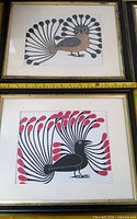 Two framed bird prints, brown/black and black/red