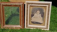Two ornate Victorian frames, one empty, one with child portrait