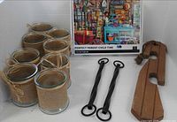 Overview: puzzle box, eight jars, two metal and two wooden hangers