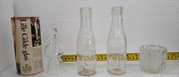 All items: two Sunnyside bottles, Lille Gilde-glas with stopper and tube, faceted tumbler