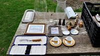 Overall view of lot including hurricane shades, frames, carving fork case, demitasse cups and assorted small items