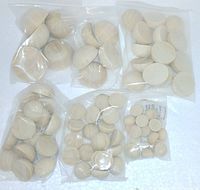 Six clear plastic bags filled with various sizes of unfinished wooden half-round circles