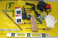 All items laid out on yellow surface for overview