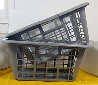 Two stacked grey laundry baskets