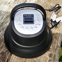 Top view of Instant Pot air fryer lid showing control panel and cord