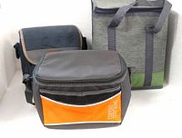 Three insulated cooler bags grouped