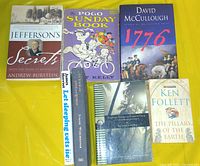 All seven books laid out showing covers and spines