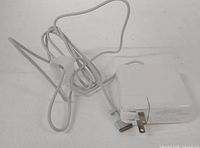 Adapter with attached cable and plug visible