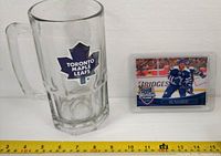 Front view of glass mug with Leafs logo and Jay McClement card front