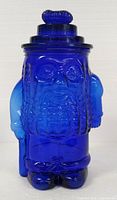 Front view of cobalt blue Mr. Peanut glass jar with lid in place