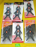 All six unopened packages of 4-inch nylon spring clamps on display