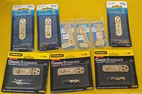 All nine packaged brass hasp and hook sets displayed